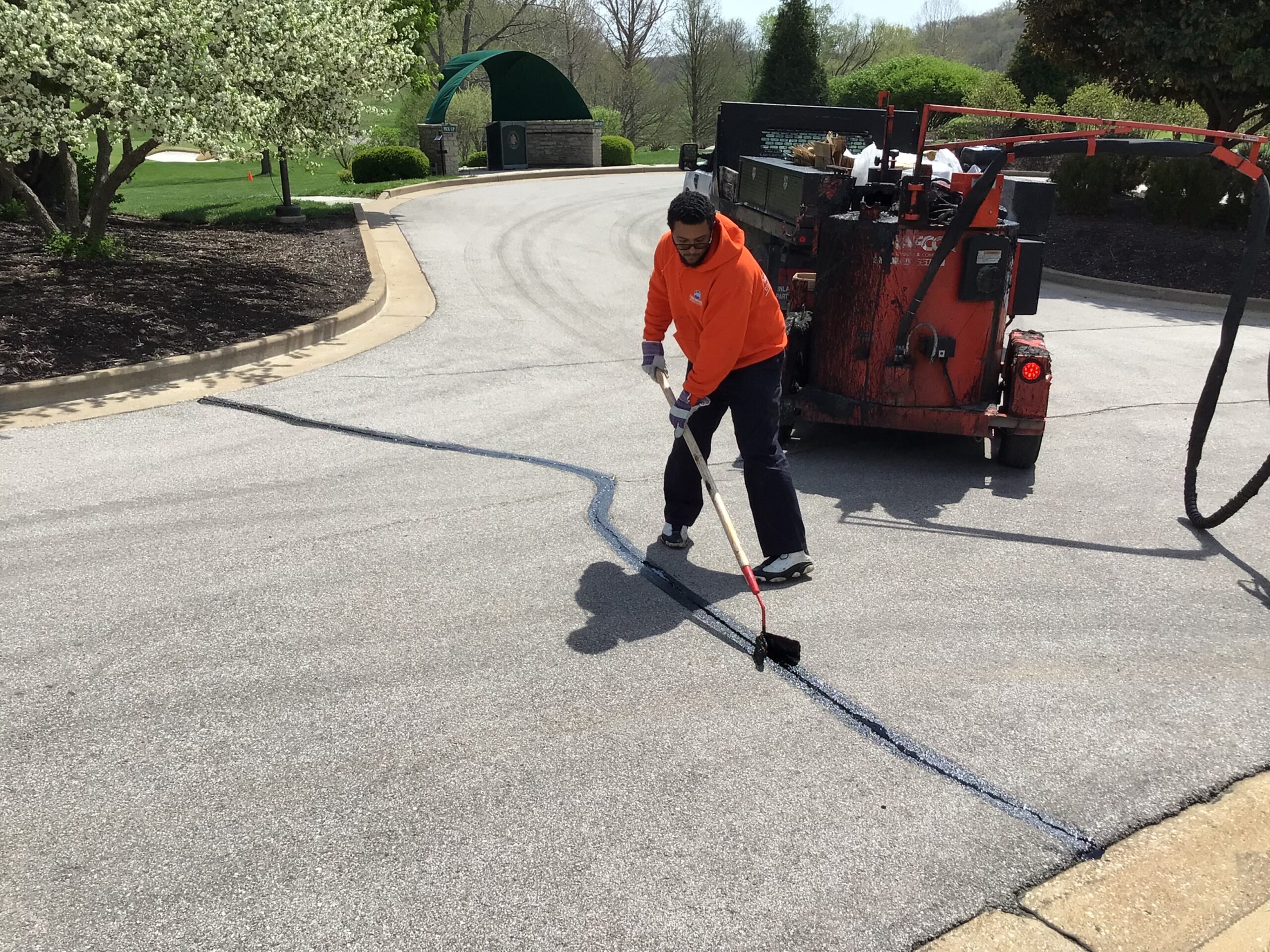 Asphalt crack sealing and paving